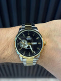 Reloj Análogo Bicolor Dorado con Esfera Negra | Estilo Luxury Elegante